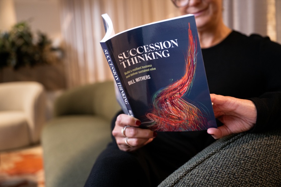 A founder reading Succession Thinking by Bill Withers